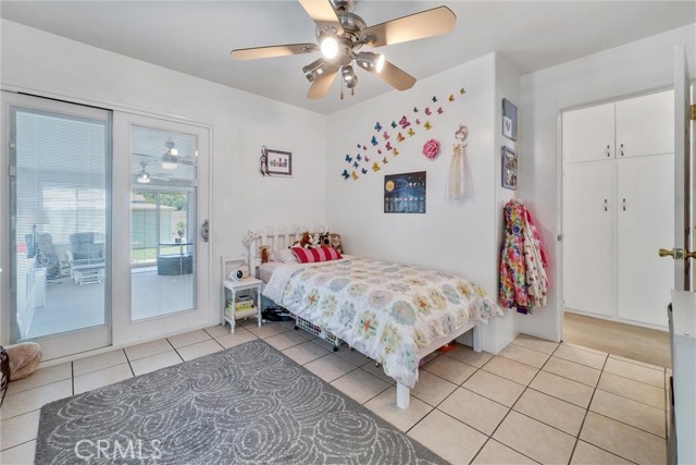 Bedroom 2. Upgraded Dual vinyl windows, plantation shutters, ceiling fan