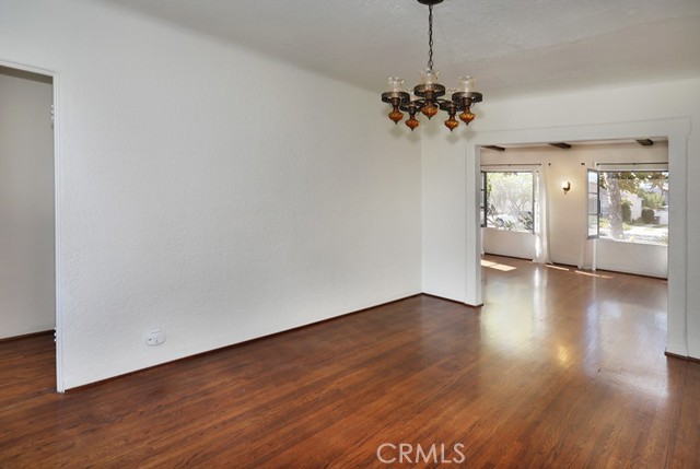 To the right of the dining room is a hallway with two of the three bedrooms and the full bathroom.