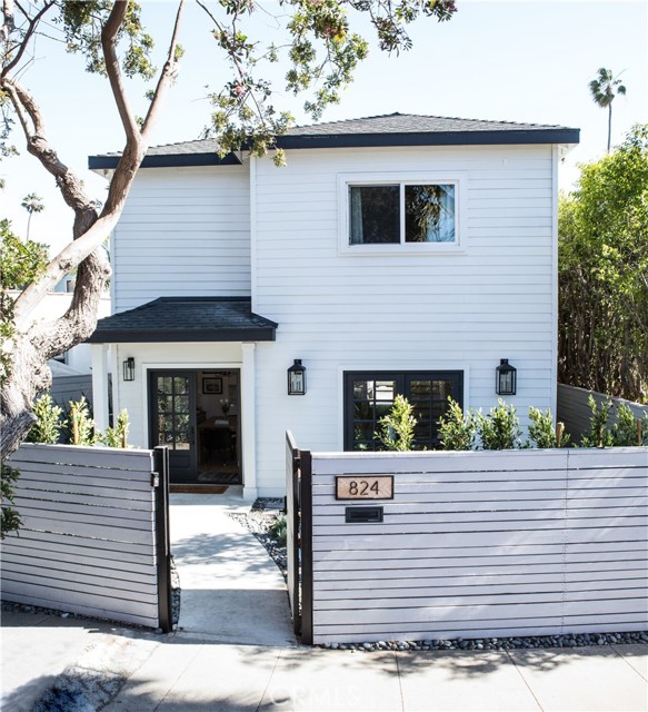 824 Venice Boulevard Venice, California Welcome home to your paradise near the ocean! This prime home in Venice spares no expense. Turnkey, modern home offers a tranquil, serene atmosphere. As you enter the privacy gate, there is a large front yard - perfect for pets & entertaining. Open concept home features the best amenities! Kitchen well-equipped with matching Stainless Steel appliances, soft closing drawers, porcelain countertops & extra tall cabinetry. The icing on the cake is the porcelain kitchen island with pot & pan drawers & desirable breakfast bar. Bright living room & dining area open up to peaceful front yard. Level 2 showcases a large master bedroom with bathroom en suite featuring dual sink vanity & chic walk-in shower. The master's walk-in closet with compartments & shelving is the cherry on top! Spacious guest bedrooms are enhanced with large walk-in closets featuring unique wall designs. Home boasts wide plank oak wood floors, recessed lighting, ceiling fans, crown molding, custom window coverings, modern light fixtures, lavish hardware & finishes, dual pane windows & central air conditioning throughout. Another desirable feature is the individual laundry room. Extra storage also found in attic, underneath staircase & in garage. Garage & gated driveway fit 4 cars comfortably. Home located in desirable, top-rated school district & nearby lively Venice Beach Boardwalk, stylish boutiques & trendy restaurants as well as the I-405, LAX, Beverly Hills & Santa Monica Pier.