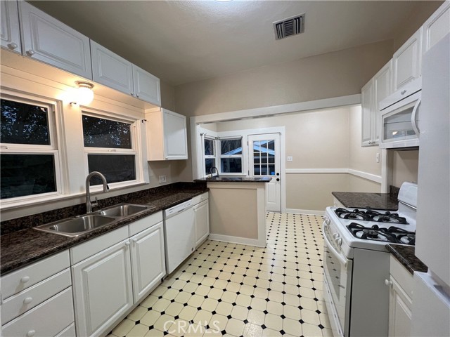 Kitchen with a breakfast nook and indoor laundry.