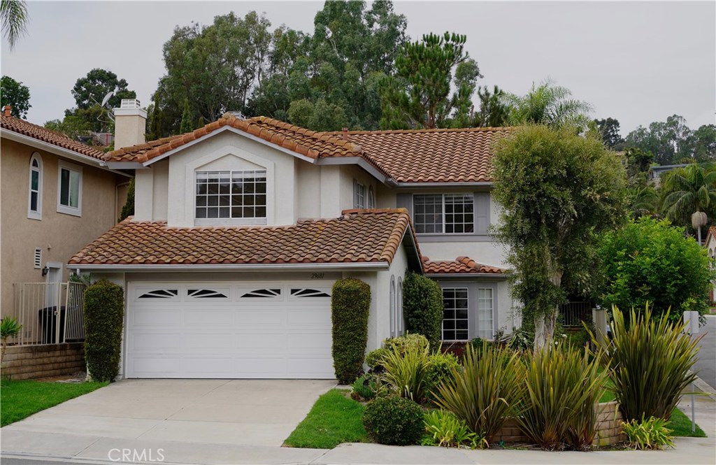 Beautiful Laguna Crest Home in a quiet neighborhood.  Wonderful curb appeal, freshly painted, double door entry with spacious living room and formal dining room.  Family room with fireplace & wet bar.  Large master suite upstairs with small walk in closet and wall closet.  All bedroom closets have closet organizers.  Secondary bedrooms are well sized with hall bath.  Kitchen includes a breakfast nook overlooking the back yard, gas cooktop and double ovens.  Private backyard for entertaining with small lawn area.  Close to schools, several markets, restaurants, and beaches.