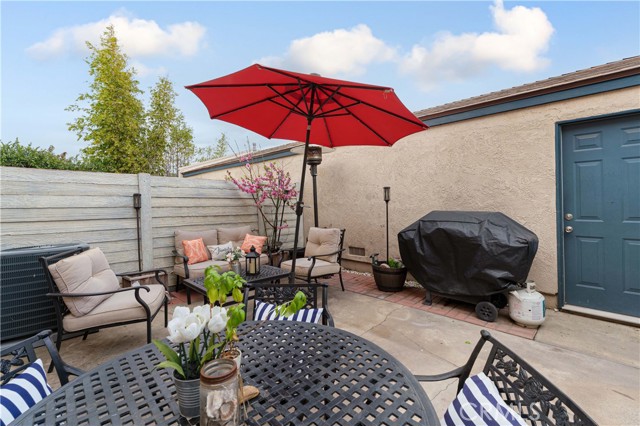 Spacious patio. Door to the right leads to large 2 car garage with laundry.