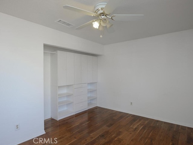 Upstairs bedroom with closet cabinets/shelving