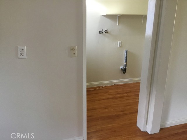 laundry room w/ hook-ups next to kitchen