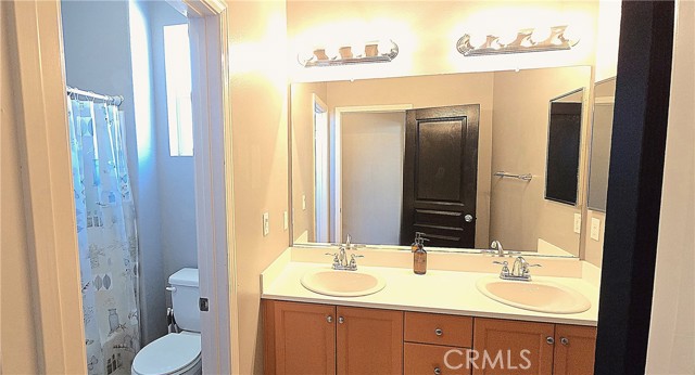 Hall bathroom has 2 sinks