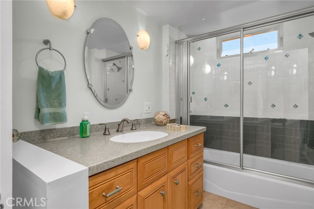 First floor central bathroom with shower and bathtub