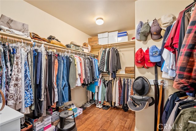 The primary bedroom has a very large walk in closet with a pocket door and solar tube for additional lighting.