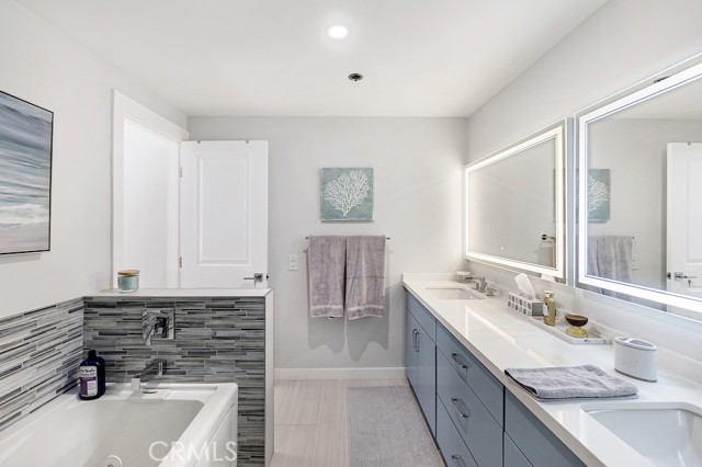 Master bathroom: double vanities with LED/defrost mirrors, jetted tub, walk-in shower