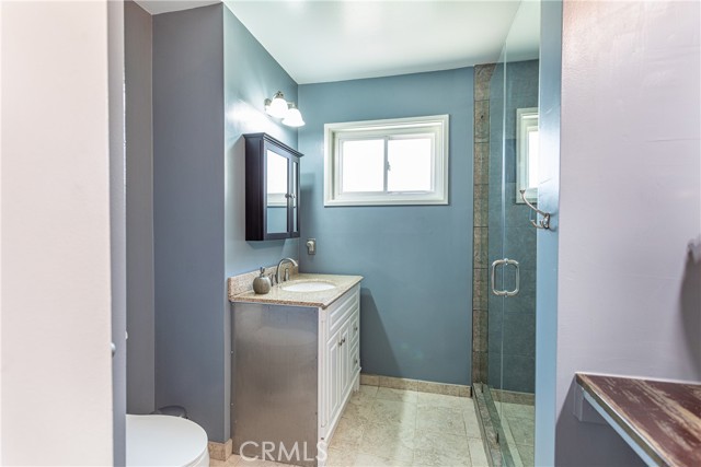 Bathroom #1 recently remodeled with stone and glass shower and counters.