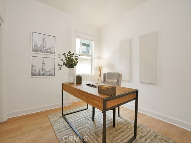 Downstairs bedroom staged as an office. Perfect for guests to stay!