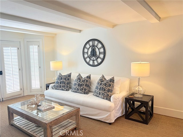 Bright family room next to kitchen.