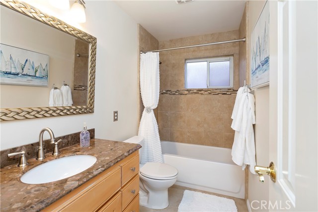 Hallway Bathroom - The vanity has a beautiful granite top.