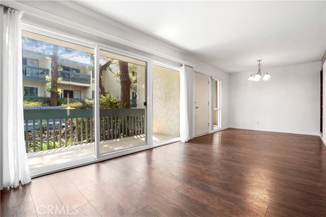 Wall of windows leading to balcony and view of the koi pond and the grounds Wall of windows leading to balcony and view of the koi pond and the grounds