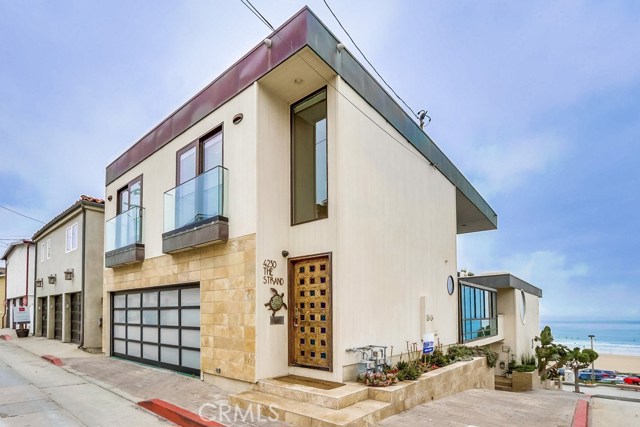 4230 The Strand Manhattan Beach, California Make your dreams come true with this gorgeous Strand home! Located in one of the most prestigious spots in the South Bay, this strand property offers captivating ocean views from all floors. After a family beach day, cozy-up to the sound of the waves in your living room and watch the dramatic fiery sunset with a perfectly angled view. Perfect home for entertaining or relaxing on the sun-drenched strand patio with shared access.
Soothing ocean breezes enliven the senses throughout the living room, kitchen and Master suite. The resort-worthy master suite enjoys a backdrop of sparkling teal water and is appointed with a custom fireplace, rain shower, and bath with a stand-alone tub perfect to pair with a glass of wine and soft candlelight. Top of the line built-in subzero, viking appliances and attention to detail makes home cooking an elegant experience for family and friends. If you're a surfer, you'll love to live right in front of the World-renowned El Porto surf break, best in the south bay. No need to check Surfline, watch the tide from the comfort of your bed. Perfect for families, equipped with under stair storage, side storage and a highly sought after full size 2 car garage. Brand new roof and 2 brand new ac units. Convenient access to LAX, downtown MB, playa vista tech and more! Live a 'vacation lifestyle' all year long with this luxurious beach getaway.
