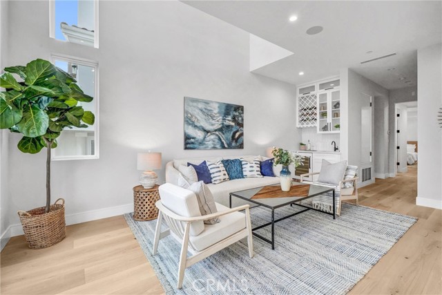 ENTRY LEVEL SITTING AREA WITH WET BAR