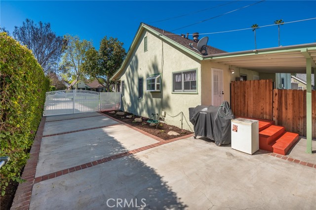 Drive way facing out from garage towards gate