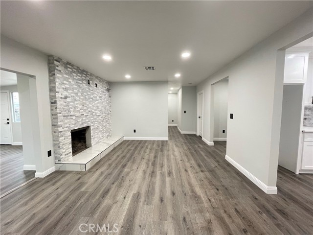 Living Room, Kitchen to the right, Hallway in the back.