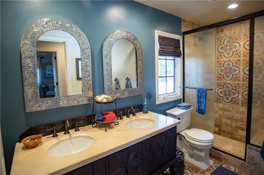 Guest bathroom. Beautiful mirrors and tile for that rustic but finished feel.