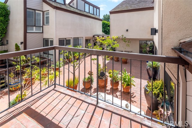 The balcony overlooks the lower courtyard.