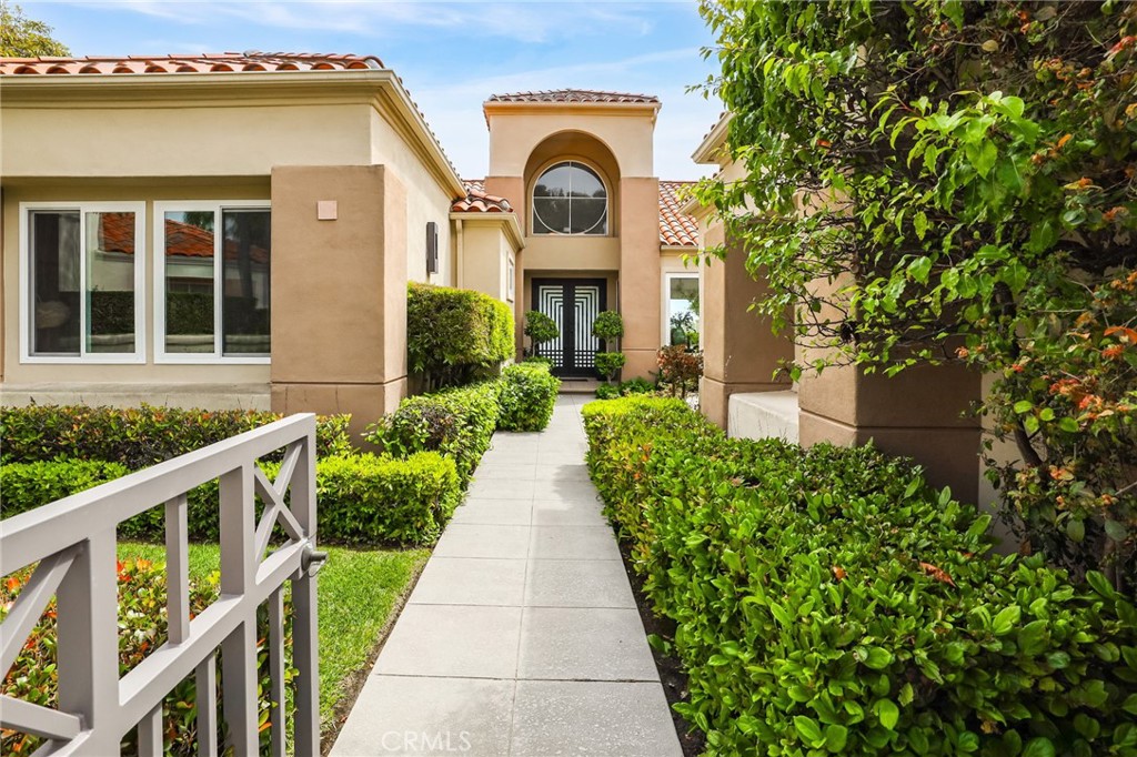 COASTAL ELEGANCE - Panoramic views are the backdrop for this exquisitely remodeled rare single-level residence. This property, previously a model home, is located on one of the most sought-after expansive pool lots within the prestigious gated community of Siena. Upon entering through the stunning, custom double doors, one is immediately presented with an uninterrupted view of the tranquil pool, hillside, and ocean in the distance. Open the glass-paneled walls to embrace an al fresco experience, seamlessly integrating indoor and outdoor living. This setting is ideal for hosting events or enjoying serene moments. The reimagined open concept floor plan flows effortlessly from the living room, family room, dining area and chef’s kitchen. The kitchen includes stone counters, sit down island, walk in pantry and six-burner Dacor range, certain to delight any culinary enthusiast. Custom-designed millwork with open display shelving separates the living room and family room, highlighting a double-sided fireplace and temperature-controlled wine storage. In the expansive primary bedroom, wake up to a stunning view through the large glass sliding doors, then enjoy the spa-inspired ensuite with a luxurious soaking tub, glass shower, custom cabinetry, and designer tile and stone. The secondary bedroom is spacious with an impressive 3/4 bathroom featuring upscale stone and tile. The third bedroom, which is open and abundant in natural light, is presently utilized as an open office. Plank wood flooring offers cohesion and warmth throughout, paired with soaring ceilings, elevated finishes and custom designed lighting, the perfect ambience is always attainable. Outdoors enjoy a private, solar-heated pool with sunset views for relaxation and entertainment. The open side yard is a grassy area suitable for planting or gardening. Residents of Siena appreciate exclusive access to a private community pool, spa, and cabana. In addition, Marina Hills Community offers a competition-sized pool, spa, clubhouse, and tennis and pickleball courts for one’s enjoyment. Experience luxurious resort living with the exceptional amenities of Marina Hills and the scenic beach trail leading to the renowned Salt Creek Beach, Waldorf Astoria and Monarch Beach Golf Course. Welcome to the sophisticated beach lifestyle of Laguna Niguel.