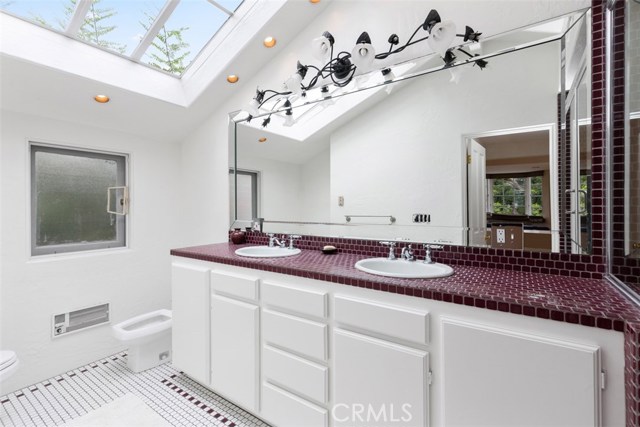 MASTER BEDROOOM WITH CLASSIC TILES, DUAL VANITY SINKS AND CUSTOM LIGHTING