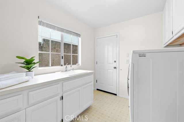 Laundry room with direct access to garage