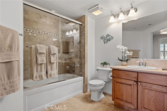 Full bath - with tub/shower combo, glass enclosure.