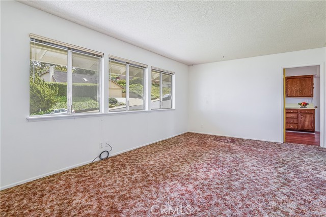 Front living room with door to kitchen