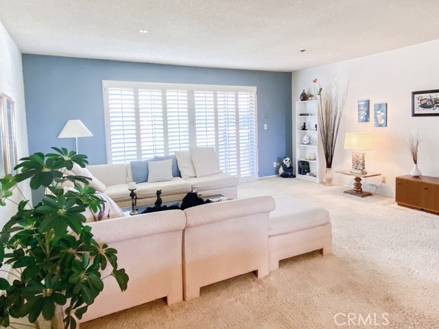 Living area and sliding doors to balcony.