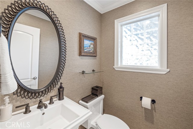 All-new powder room with custom textured wallpaper