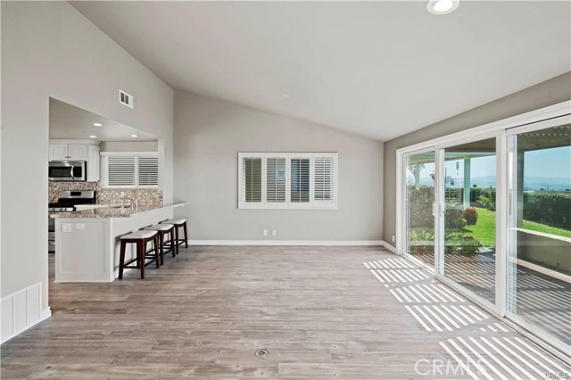 This angle is looking from the living room towards the kitchen and dining room. There are views no matter which direction you look...this photo shows city and mountain views.
