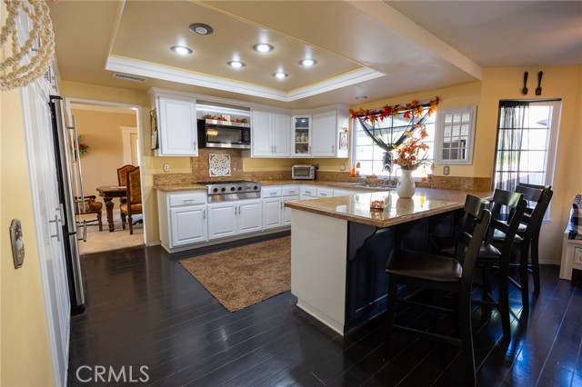 Open kitchen area with plenty of counter space and cabinets.