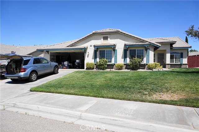 13255 Rolling Hills Lane Victorville, California This home for rent has 4 spacious bedrooms plus a den/office with 3 full bathrooms, a separate living room with high vaulted ceiling, and a separate family room with a cozy rustic masonry fireplace. The front yard has a lush green lawn with complete landscaping and the back yard has full hardscaped with a cover patio. The house has been cleaned up nicely inside and out including freshly steamed clean carpet and is ready for move-in now. Rent also includes landscaping maintenance.
