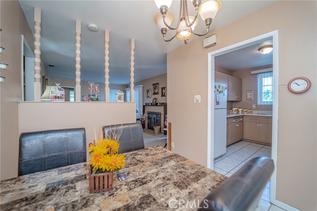 Dining room opens to the living room and kitchen.