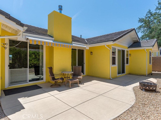 Rear patio has a remote controlled  Sunsetter awning