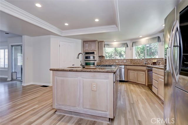 Island with utility sink. Pantry next to ovens.