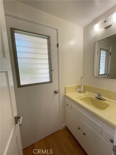 Bathroom off laundry room and kitchen