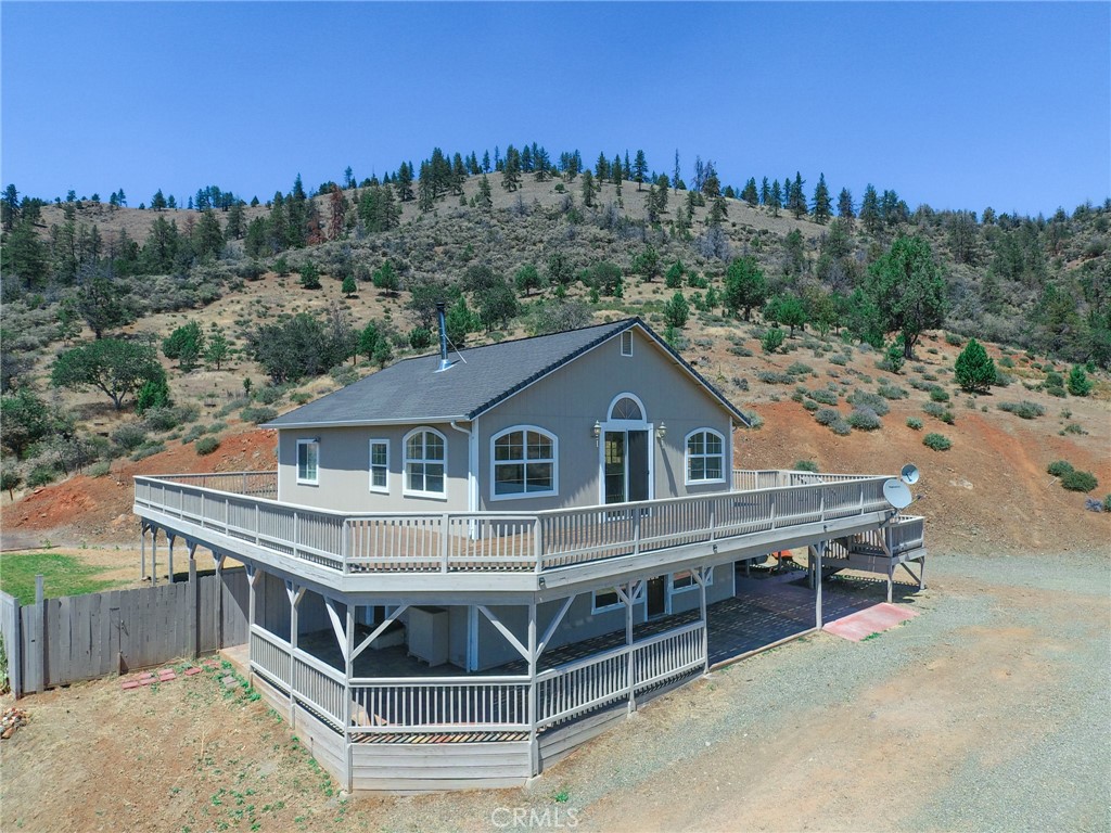 1515 Shasta View Yreka, California Welcome to your private oasis in Yreka! This rare gem boasts a 3-bedroom, 2.5-bathroom plus a dedicated game room. Bulit in 2008 and renovated in 2018, the house exudes modern charm with a new kitchen featuring quartz countertops and luxury vinyl plank flooring throughout. No need to worry about the temperature—this home is equipped with a state-of-the-art Mitsubishi mini split system for heating and cooling, ensuring comfort year-round. For those who love the rustic touch, a wood-burning stove awaits, promising cozy winter nights and a warm ambiance. Entertain in style in the game room, complete with a sleek wet bar featuring granite countertops. Gather with friends and family for unforgettable moments in this perfect entertainment space. Step outside to discover a meticulously maintained paver patio and lush lawn area, complemented by a high-pressure sprinkler system and a convenient water storage system. But the best feature is undoubtedly the expansive 4,000 square foot wraparound deck. Take in breathtaking views of Greenhorn Lake and the majestic Mt. Shasta as you relax and unwind in the serenity of your own slice of paradise. Don't miss the chance to make this dream property your reality—schedule a showing today and experience the unparalleled charm and luxury of this Yreka retreat!