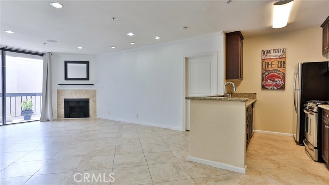 7320 Hawthorn Avenue 411 Hollywood, California This spacious 2 bed-2 bath is in the upscale Hollywood Regis community. Amenities include a resort-style pool and spa, high end fitness center, fireplace, and assigned parking with a gated 2-car garage (tandem). For this unit, location is key. You will be walking distance to attractions such as the Hollywood Walk of Fame, Dolby Theater, Hollywood Bowl and the beautiful 130-acre Runyon Canyon park, with extensive biking and hiking trails. At the same time, you will have easy accessibility to the metro rail lines, and the 101-freeway entrance. The unit features 2 large bedrooms separated by a spacious tile living and dining room. It has luxurious bathrooms with granite countertops, and a fully equipped granite countertop kitchen which includes stainless steel appliances, and a dishwasher. It also includes LG state of the art combination washer-dryer. The Master suite features a walk-in closet. You will also have your own private balcony, overlooking the pool. The building has controlled access entry with a nighttime security guard and covered and gated parking with EV Charging. The HOA fee includes a 6x6 storage area in the garage.