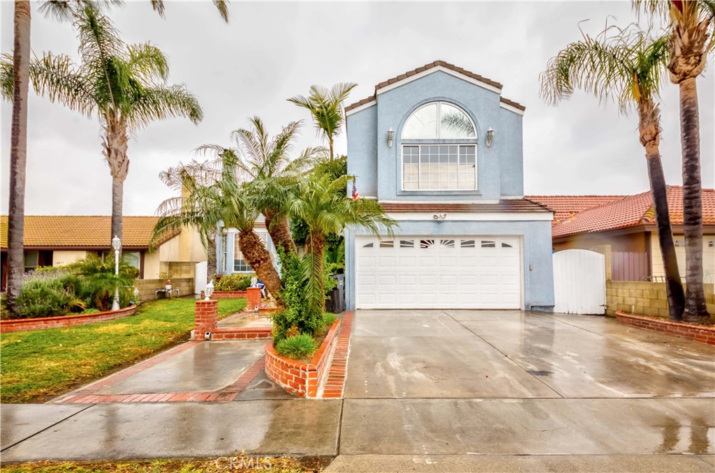 Welcome Home to 18827 San Gabriel Avenue in the Prestigious City of Cerritos! Elegant estate nestled in a prime location with lush Westgate park view. You'll fall in love with the inviting curb appeal w/a cozy front porch & brick accents. Offering a 4 Bed plus bonus room/3 bath floor plan with appx. 2,873 sq ft of abundant living space & appx. 4,999 lot space! Formal living room w/high vaulted ceiling & cozy fireplace and tons of natural lighting shines throughout! Open floor plan w/large kitchen featuring granite countertop, built in electric cooktop, tons of countertop/cabinet space, breakfast counter & more! Kitchen opens up to a separate dining nook and opens up to a huge family room w/cozy fireplace - Dual sliding doors to access to the backyard. Convenient main floor bed & bath! Bonus room between the living space & garage for tons of storage and more! The second level provide a huge master suite w/private balcony, fireplace, ensuite bath w/soaking tub, separate shower & walk-in closet. Huge bedroom w/dual closets. Another bedroom w/ensuite jack n jill bath. Convenient laundry room upstairs. Nicely sized backyard w/covered patio and plenty of space to host family & friends. This lovely home is ready for it's new owner to manifest their dream home in this Prime Cerritos neighborhood! Centrally located near Blue Ribbon schools district, Cerritos town center, Cerritos Mall, College, shopping, dining, parks, entertainment & easy 91/605 fwy commute. Don't miss this once in a lifetime opportunity!