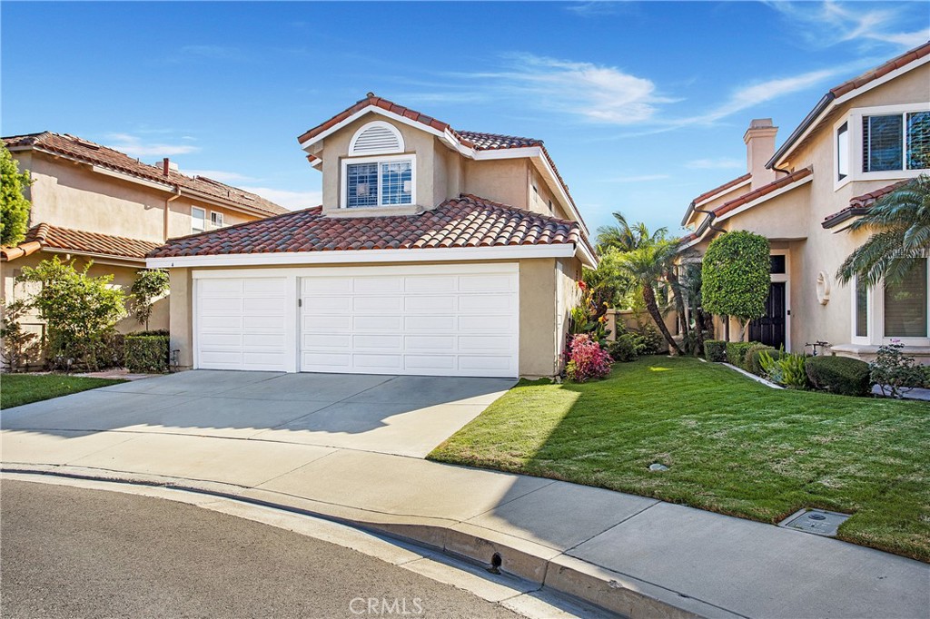 Nestled within the prestigious Marina Hills community of Laguna Niguel, this exceptional two-story residence offers an unparalleled living experience in one of Southern California's most coveted neighborhoods. This 4-bedroom, 3-bathroom residence, with numerous amenities and upgrades, is situated on a spacious cul-de-sac in this outstanding community. Upgrades/ amenities include vaulted ceilings, marble entrance, custom crown molding, plantation shutters, luxury vinyl flooring, custom baseboards, both formal dining and living room areas, family room fireplace with custom marble hearth and a separate main floor laundry room. In addition, the spacious ‘center island’ family kitchen contains newly renovated kitchen cabinets, granite countertops, as well as both Samsung and GE profile appliances. All bedrooms contain mirrored closet doors and plantation shutters, the master bedroom suite includes a custom ‘walk in’ cedar lined closet, vaulted ceilings and ensuite bathroom with custom cabinetry, quartz countertop, dual sinks, newer light fixtures, and a marble/tile shower with a seamless shower door system. All bathrooms have been upgraded with cabinetry, countertops, flooring, and newer lighting and plumbing fixtures. This light and bright, and open and spacious floor plan has been totally re-piped with Pex Piping, contains a newer HVAC system and oversized, attached 3 car garage with additional outside parking for 3 additional vehicles. The low maintenance backyard is extremely private and boasts a large, covered patio. Positioned on a quiet cul-de-sac with direct access to a multi-use trail system, this stunning home has a wealth of community amenities including pool, spa, tennis and pickleball and is situated near top-rated schools, shopping, and entertainment options. Minutes away to both the Waldorf Astoria and Ritz Carlton Resorts as well as the world-renowned Salt Creek Beach with its incredible surf breaks. Equally close is Dana Point Harbor and its Lantern District, with numerous shopping and dining establishments. This is truly an outstanding opportunity in the acclaimed community of Marina Hills, located in Laguna Niguel!