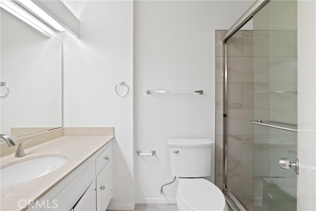 The primary suite is a spacious bedroom closet, and primary bath with dual vanities.