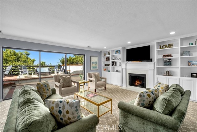 Formal living room with wood burning fireplace.