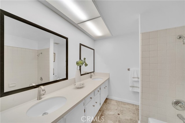 Upstairs guest bathroom with new quartz counters, mirrors and faucets