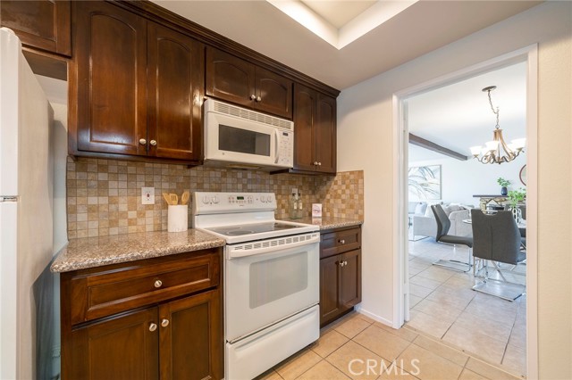 Lots of cabinets and counters throughout kitchen