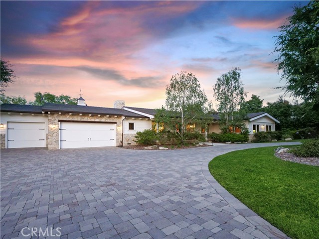 circular driveway and 3-car garage