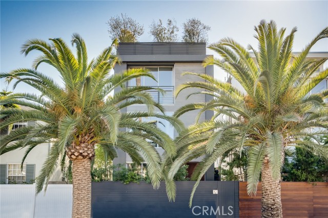 406 Grand Boulevard Venice, California Just blocks from the world-famous Venice Beach Boardwalk, Abbot Kinney and Venice Canals this recently renovated 3 story, 4 bedroom & 5 bath house offers the perfect living with ocean breeze, sunset and beautiful views from the roof top. The modern open style floor plan invites you through the private gated front garden patio into the Livingroom/Family room area with sliding glass doors. The gourmet kitchen is equipped with Miele appliances including built in Coffee Machine to starts anyone’s morning right with that perfect cup of espresso or cappuccino to enjoy at the breakfast bar with Caesarstone countertops. Ground level continues with a naturally light hallway into the newly converted garage equipped with Tonal intelligent home gym system. This area could also be used for perfect home office/studio with attached 2 car garage. The second floor features a primary bedroom, 2 guest bedrooms with closets, full bathroom with Jacuzzi tub & laundry room. The third floor of this spectacular residence offers an entertainment room with theater projection, master suite with a spa style en suite bathroom, walk-in shower, walk in closet and balcony with breathtaking views to enjoy with you breakfast in bed. The final icing is the newly renovated large roof deck with lounge area, fire pit, BBQ including a build in fridge and sink, fire pit, outdoor entertainment, spa and the panoramic views. This house is perfectly balanced and one of the finest coastal livings you can find in the beautiful Venice strolling on your bike through the best eateries & shops.