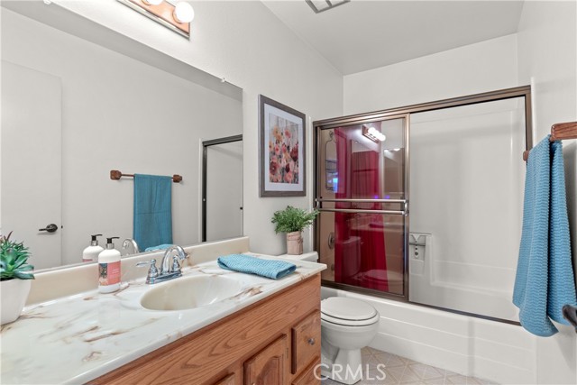 Here is your Full Guest bath.  Located between all 3 bedrooms.  Shower in tub tinted sliding glass doors.