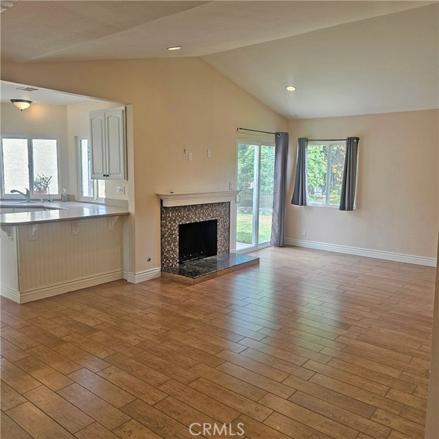 Large living room opens to the kitchen and a fireplace
