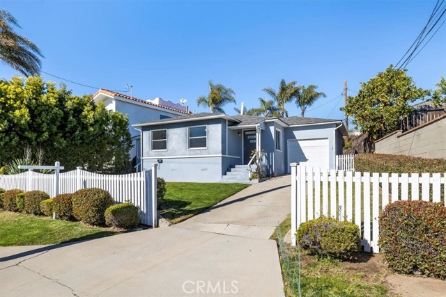 Single family with white picket fence